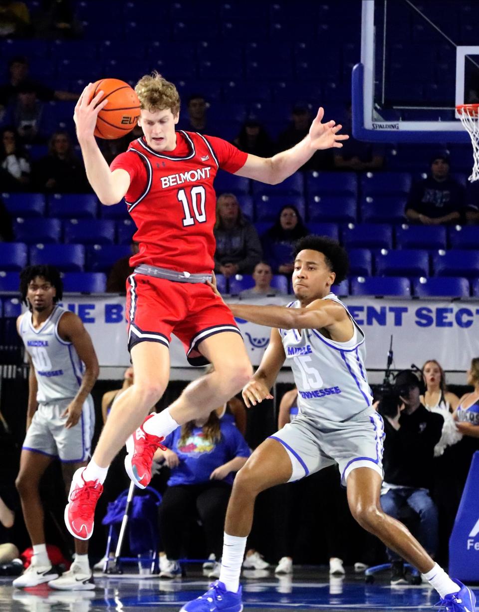 Belmont guard Cade Tyson (10) grabs the ball as Middle Tennessee guard Jacob Johnson (15) guards him during the men’s basketball game on Saturday, Dec. 9, 2023, at MTSU..