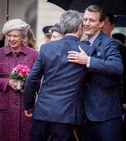<p>Patrick van Katwijk/Getty </p> Prince Joachim hugs King Frederik at the Danish Parliament's celebration of the succession of the throne at Danish Parliament on Jan. 15, 2024 in Copenhagen.