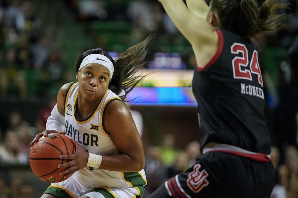 Baylor’s Sarah Andrews, left, drives to the basket against Utah’s Kennady McQueen during the second half of an NCAA college basketball game, Tuesday, Nov. 14, 2023, in Waco, Texas. Baylor won 84-77. | Julio Cortez, Associated Press