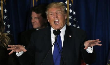 Republican U.S. presidential candidate Donald Trump reacts at his 2016 New Hampshire presidential primary night rally in Manchester, New Hampshire February 9, 2016. REUTERS/Jim Bourg