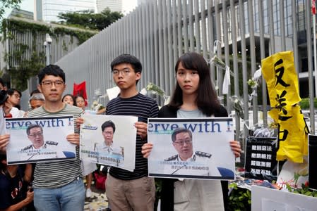 FILE PHOTO: Pro-democracy activists Nathan Law, Joshua Wong and Agnes Chow attend a news conference regarding the proposed extradition bill, outside the Legislative Council building in Hong Kong