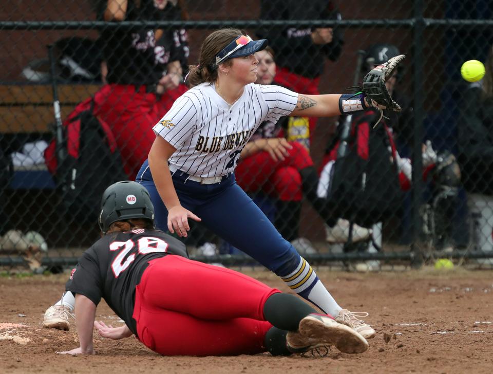 Tallmadge first baseman Kathryn Headrick tries to make the play at first during a game earlier this season.