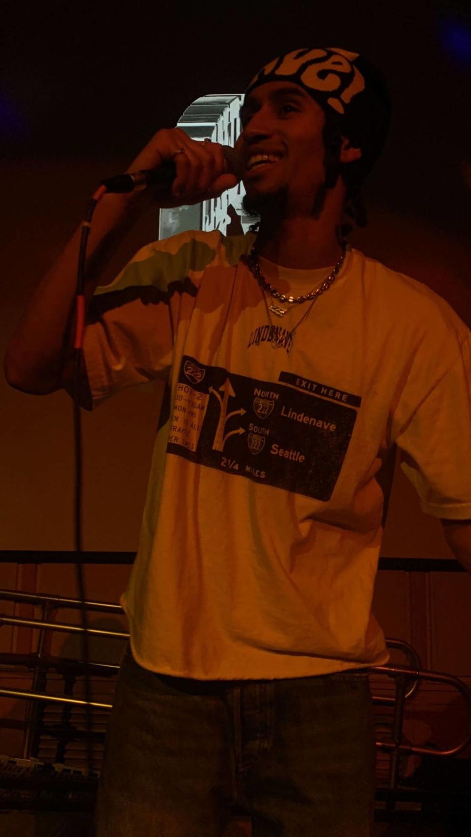 Rapper Oblé Reed smiles at the crowd in the Reid Ballroom on campus at Whitman College while he performs songs from his repertoire on Feb. 23.