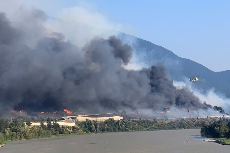 FILE PHOTO: Smoke rises above the small western Canadian town of Lytton after wildfires forced its residents to evacuate