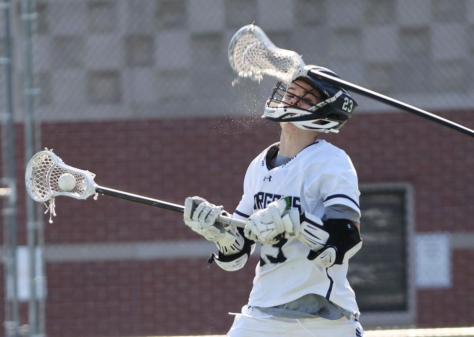 Corner Canyon’s Conner Zaharis (23) is hit in the head against Farmington in the 6A boys lacrosse state semifinal in Salt Lake City on Wednesday, May 24, 2023. Corner Canyon won 12-0. | Jeffrey D. Allred, Deseret News