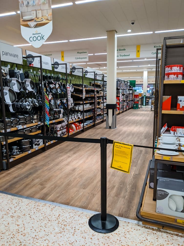 barrier with sign stopping access to supermarket shelves