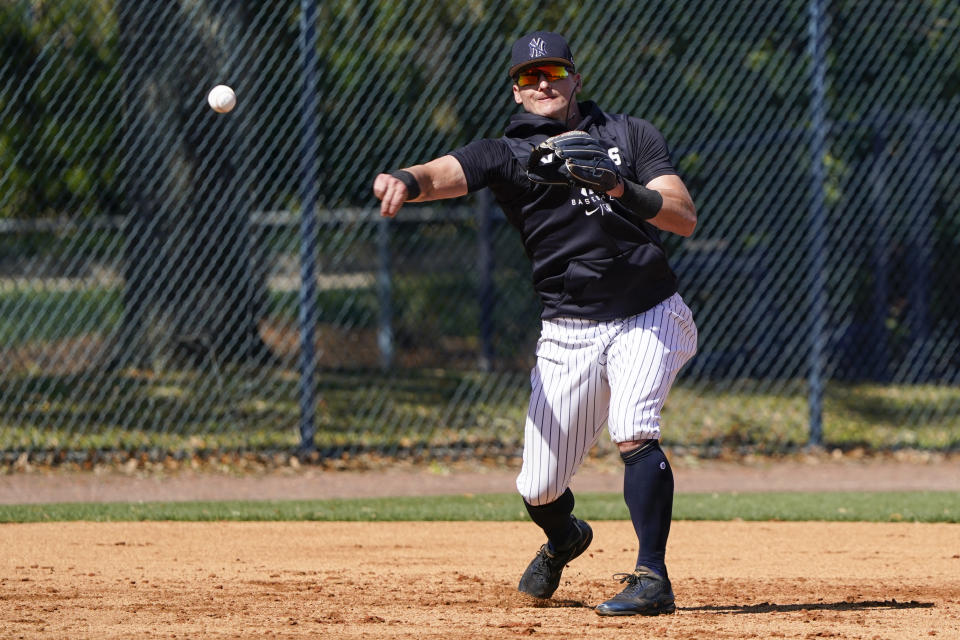 New York Yankees infielder Josh Donaldson throws to first base during a spring training baseball workout, Monday, March 14, 2022, in Tampa, Fla. (AP Photo/John Raoux)