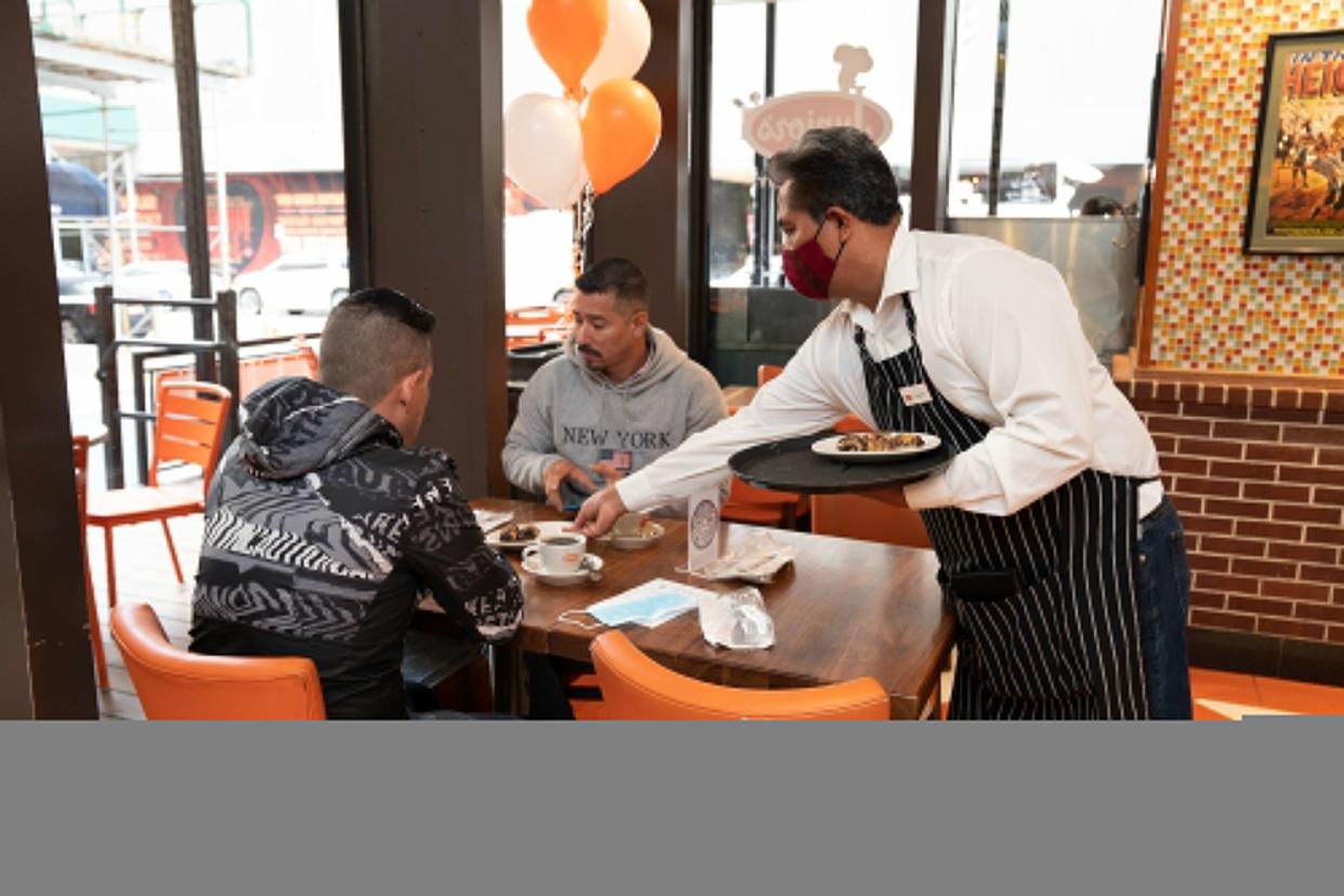 Guests enjoy Junior's after re-opening Thursday, May 6, in Manhattan, New York. 