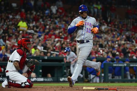 Apr 19, 2019; St. Louis, MO, USA; New York Mets center fielder Juan Lagares (12) scores on a single by second baseman Robinson Cano (not pictured) during the second inning against the St. Louis Cardinals at Busch Stadium. Mandatory Credit: Jeff Curry-USA TODAY Sports