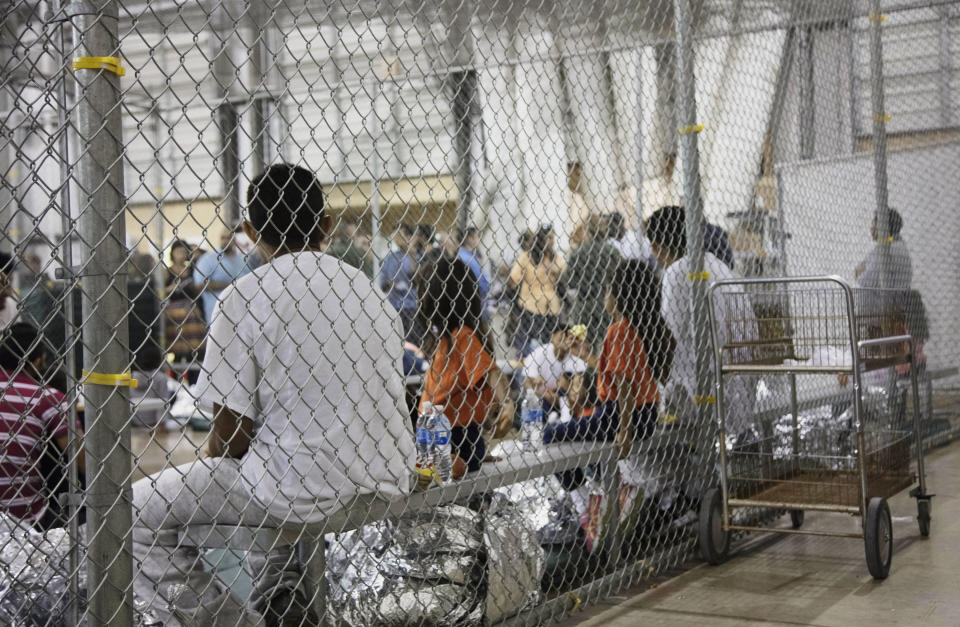FILE - In this photo provided by U.S. Customs and Border Protection, people who've been taken into custody related to cases of illegal entry into the U.s., sit in one of the cages at a facility in McAllen, Texas, on June 17, 2018. The 9th Circuit Court of Appeals issued a ruling Monday, May 22, 2023, reversing a Nevada federal judge’s unprecedented decision more than two years ago that struck down a felony deportation law as unconstitutional and discriminatory against Latinos. (U.S. Customs and Border Protection's Rio Grande Valley Sector via AP, File)