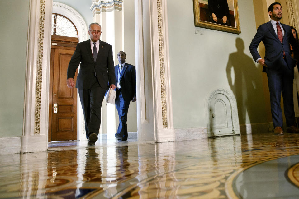 Senate Minority Leader Sen. Chuck Schumer of N.Y., left, arrives to speak to the media about an impeachment inquiry on President Donald Trump, Wednesday Sept. 25, 2019, on Capitol Hill in Washington. (AP Photo/Jacquelyn Martin)