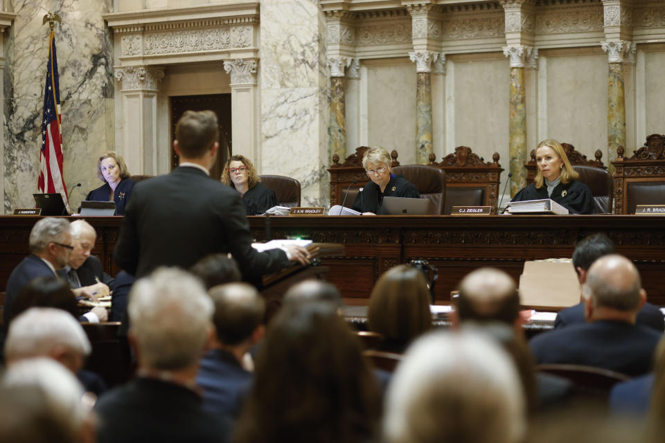 Wisconsin Supreme Court Justices Jill J. Karofsky, Rebecca Frank Dallet, Ann Walsh Bradley and Chief Justice Annette Kingsland Ziegler listen to arguments by Mark Gaber during a redistricting hearing at the Wisconsin state Capitol Building in Madison, Wis., on Tuesday, Nov. 21, 2023. (Ruthie Hauge/The Capital Times via AP, Pool)