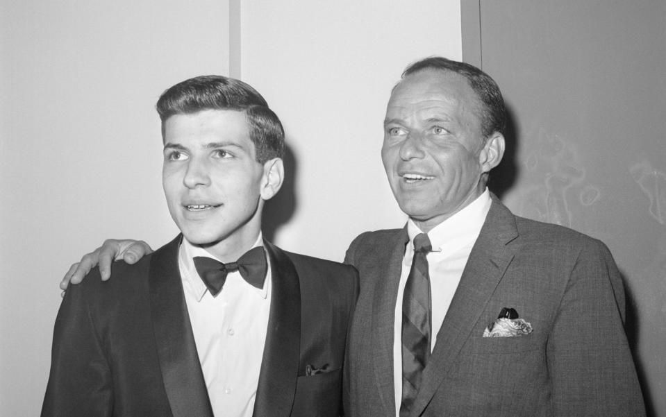 Frank Jr and his father, pictured in the year of the kidnap - Bettmann