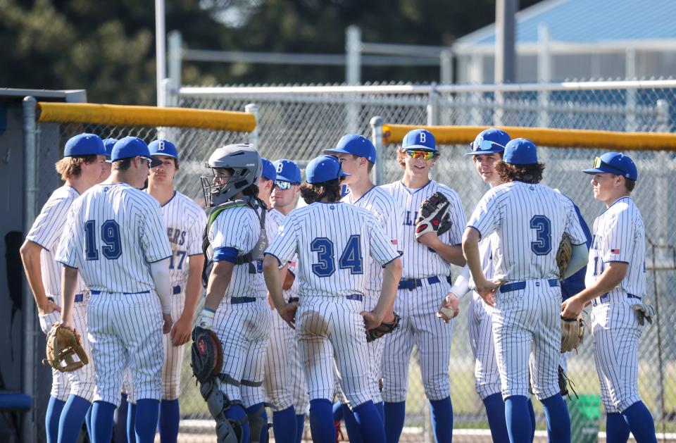 Blanchet Catholic huddles before the game against Kennedy on Wednesday, May 8, 2024 in Salem, Ore.