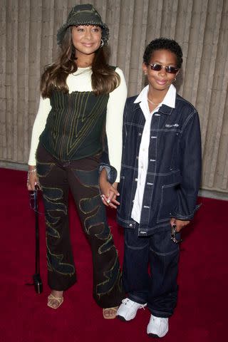 <p>Frank Trapper/Corbis via Getty</p> Raven-Symoné and brother, Blaize, at the Dr. Dolittle 2 premiere in 2001.