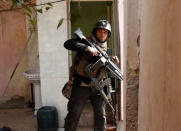 An Iraqi special forces soldier searches a house during a battle with Islamic State militants in Mosul, Iraq March 1, 2017. REUTERS/Goran Tomasevic