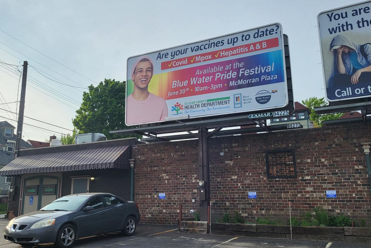 A St. Clair County Health Department billboard, shown on Thursday, May 16, 2024, promotes the agency's services at a Pride event in June. This billboard is one of three currently up, in addition to another three that'll be up next month, and is located outside the Blue Water Ally Center beside other advertisements at Military and Griswold streets in Port Huron.