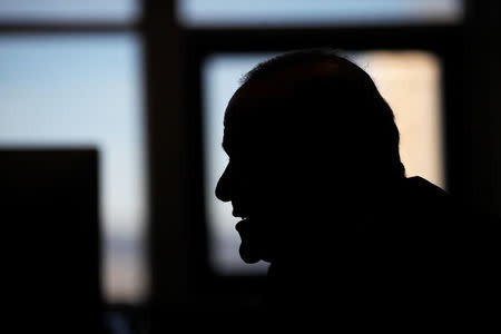 Gibraltar's financial services and gaming Minister Albert Isola is silhouetted as he answers a question during an interview with Reuters in the British overseas territory of Gibraltar, historically claimed by Spain, September 14, 2016. REUTERS/Jon Nazca