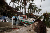 <p>A person walks amidst debris on the seashore in the aftermath of Hurricane Fiona in Punta Cana, Dominican Republic, September 19, 2022. REUTERS/Ricardo Rojas</p> 