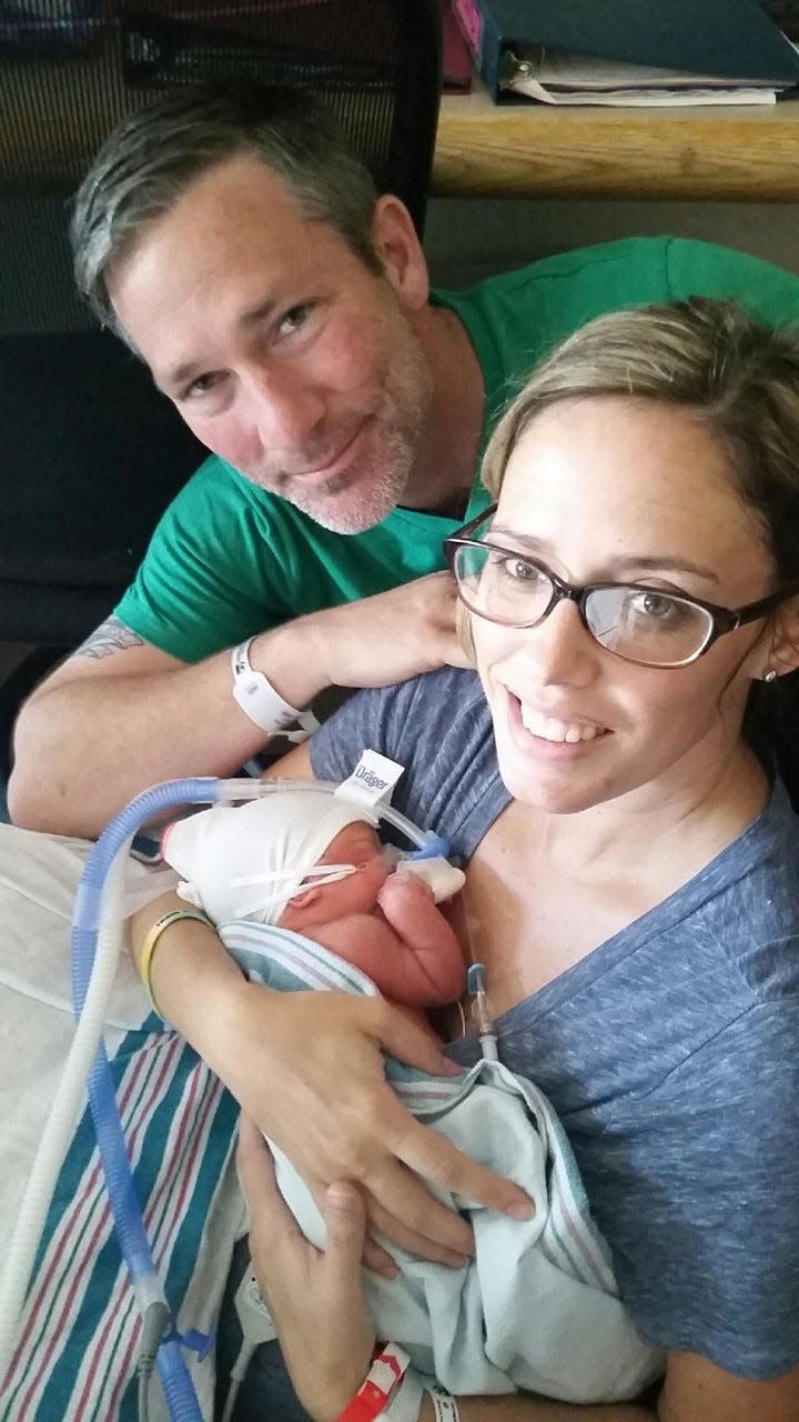 Bill Raney (Left) and his wife Lauren (Right) welcome their third child.