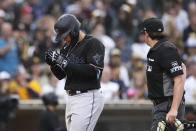 Miami Marlins' Joe Dunand, left, celebrates as he nears home plate after hitting his first career home run against the San Diego Padres in the third inning of a baseball game Saturday, May 7, 2022, in San Diego. (AP Photo/Derrick Tuskan)