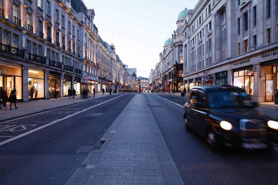 A lone taxi drives down an almost deserted Regent Street in London, England, on March 16, 2020. Around the country, as elsewhere in the world, covid-19 coronavirus fears continue to escalate as the numbers of cases and deaths continues to rise. British Prime Minister Boris Johnson this afternoon announced a ramping-up of measures designed to slow the spread of the virus in the UK, including asking for everyone to work from home where possible and for people to avoid 'non-essential' contact with others. (Photo by David Cliff/NurPhoto via Getty Images)