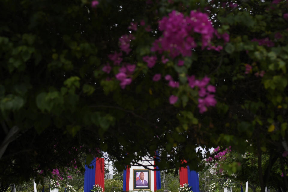 A photo of late Haitian President Jovenel Moise is displayed at the National Pantheon Museum before a ceremony in his honor in Port-au-Prince, Haiti, Tuesday, July 20, 2021. Moise was assassinated at home on July 7. (AP Photo/Matias Delacroix)