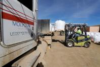 A forklift operator arranges 1,500 kg bags of bastnasite concentrate for shipping at the MP Materials, formerly Molycorp, rare earth mine in Mountain Pass