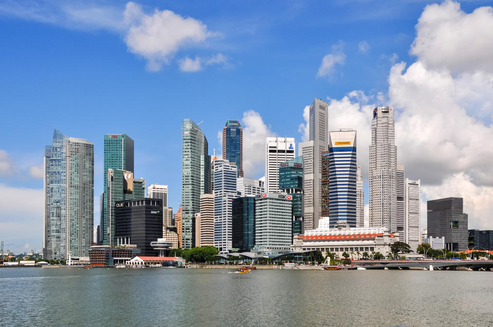 Singapore, Republic of Singapore - May 16, 2015: Skyline of Singapore. Financial district, the Merlion, a symbol of Singapore, The Fullerton Hotel.