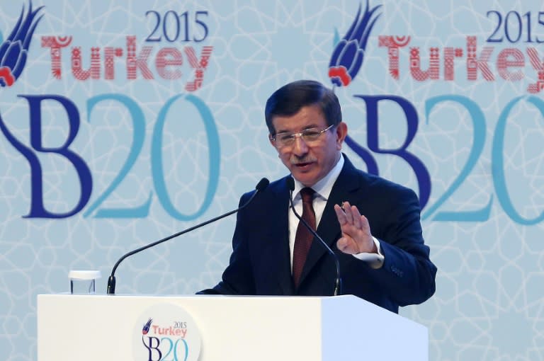 Turkish Prime Minister Ahmet Davutoglu delivers a speech during the G20 finance ministers meeting in Turkey, on September 4, 2015, in Ankara