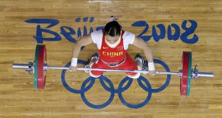 Chen Xiexia of China competes in the women's 48kg Group A snatch weightlifting competition at the Beijing 2008 Olympic Games August 9, 2008. REUTERS/Yves Herman