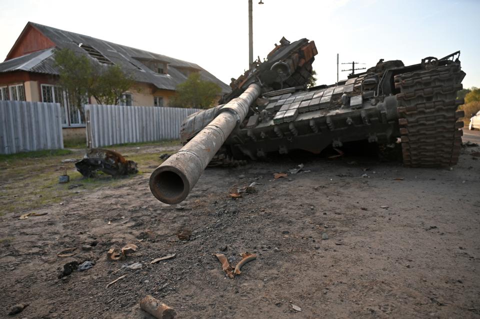 This photograph taken on October 7, 2022 shows a destroyed Russian tank on a road near Izyum, eastern Ukraine. (Photo by SERGEY BOBOK / AFP) (Photo by SERGEY BOBOK/AFP via Getty Images)