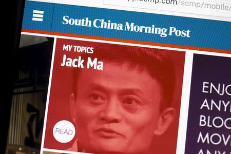 A photo illustration shows the South China Morning Post website displayed on a computer in Hong Kong, China, November 23, 2015. REUTERS/Tyrone Siu