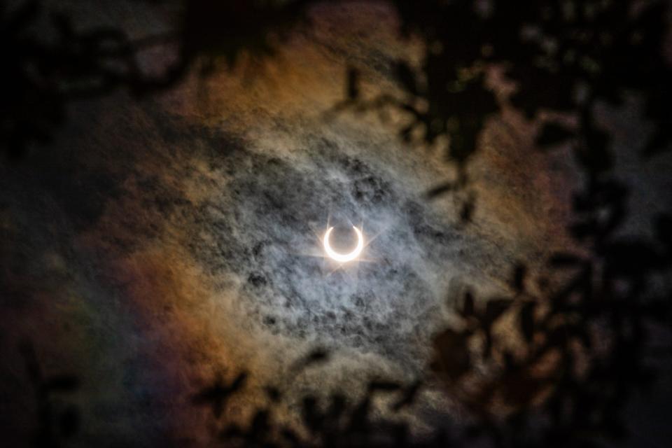 The moon moves in front of the sun, creating a shadow during an annular solar eclipse at Lake Corpus Christi State Park on Saturday, Oct. 14, 2023, in Mathis, Texas.