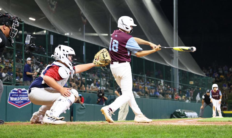 Jayden Murphy of the New England Little League champion Middleboro 12u Nationals connects for a base hit to score two runs during a game against Mid-Atlantic champion Hollidaysburg, Pennsylvania, at Howard J. Lamade Stadium  at the Little League World Series in South Williamsport, Pennsylvania, on Saturday, Aug. 20, 2022.