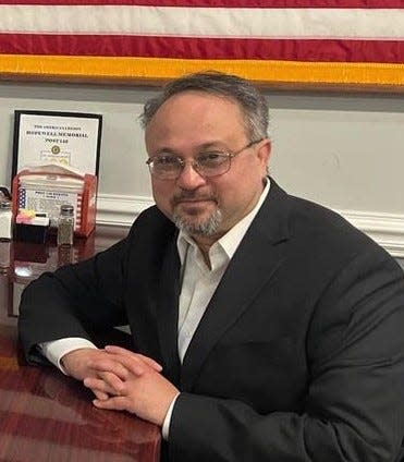 United States Air Force veteran Chai Gallahun strikes a pose in the Club Room at Hopewell American Legion Post 146 in Hopewell, Va. in March 2022.