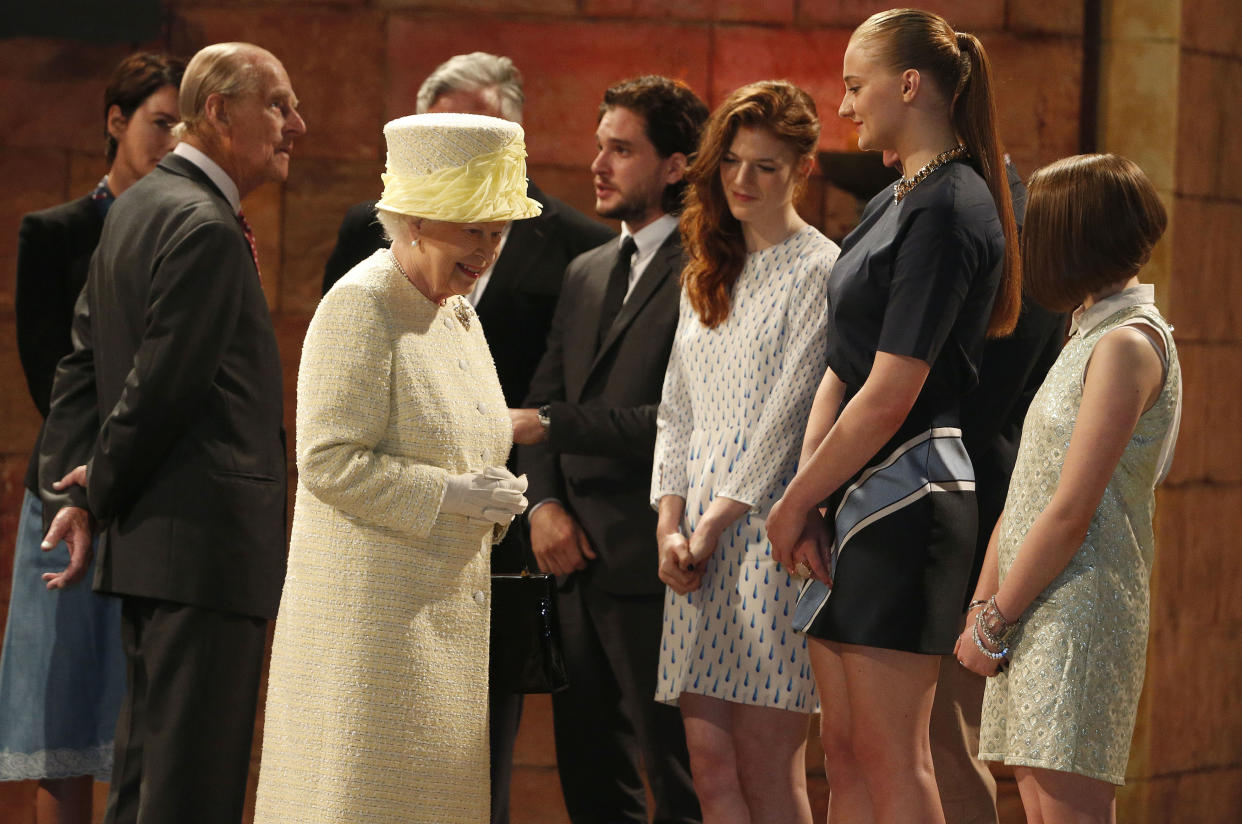 Britain's Queen Elizabeth and Prince Philip talk with members of Game of Thrones Cast (REUTERS)