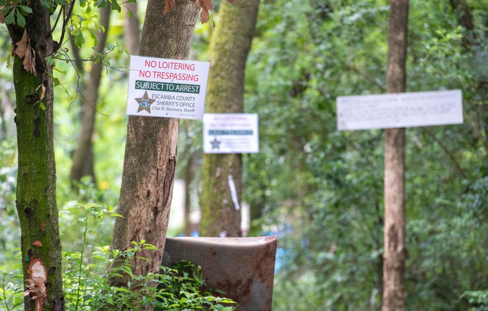 "No Loitering No Trespassing" signs from the Escambia County Sheriff's Office have been posted around the homeless camps off Murphy Lane in Brent on Wednesday, July 19, 2023. The property owner is working to clear the camp to reduce nuisance to neighboring homeowners.