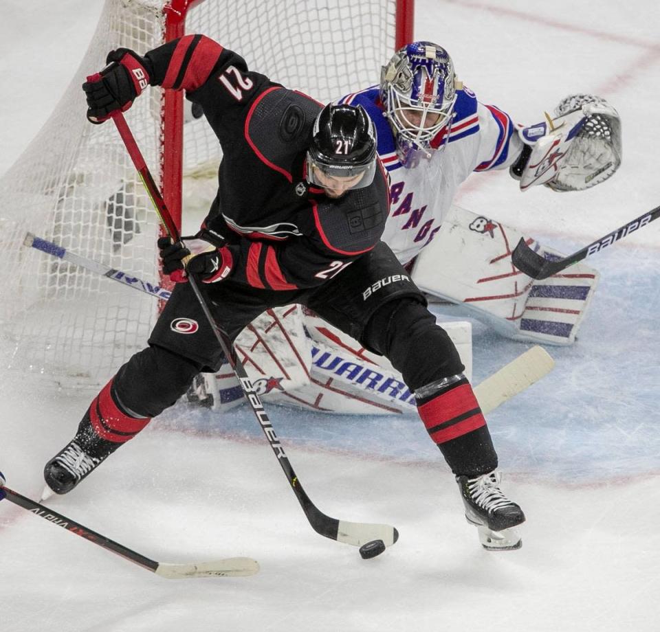 The Carolina Hurricanes’ Nino Niederreiter (21) controls the puck in front of New York Rangers’ goalie Igor Shesterkin (31) during the first period on Thursday, May 26, 2022 during game five of the Stanley Cup second round at PNC Arena in Raleigh, N.C.
