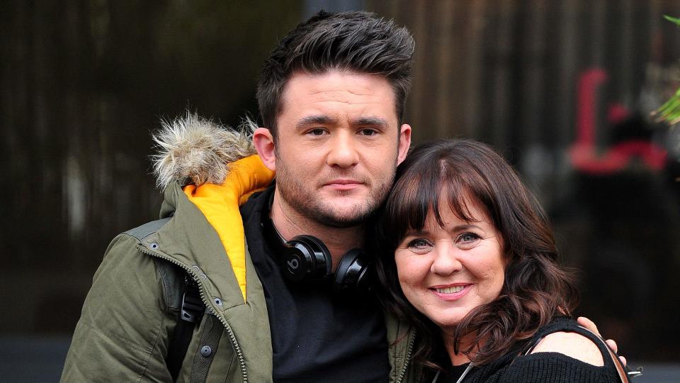 Coleen Nolan embracing son Shane Jr. outside