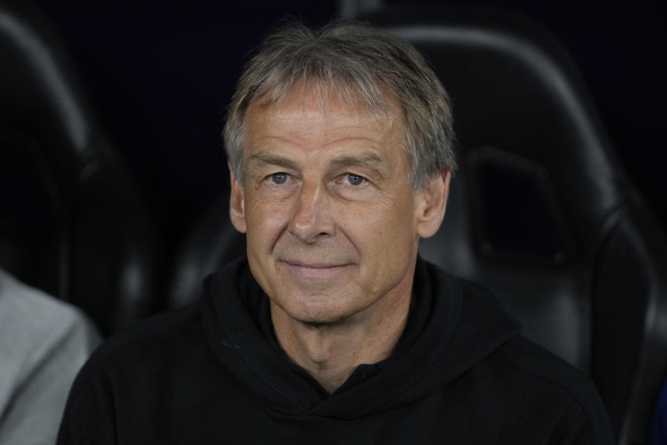 South Korea's head coach Jurgen Klinsmann looks on before the semi-final soccer match between Jordan and South Korea at Ahmad Bin Ali Stadium in Al Rayyan, Qatar, Tuesday, Feb. 6, 2024. (AP Photo/Thanassis Stavrakis)