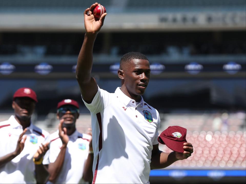 Joseph holds the ball aloft in Adelaide after taking five wickets against Australia (Gett)