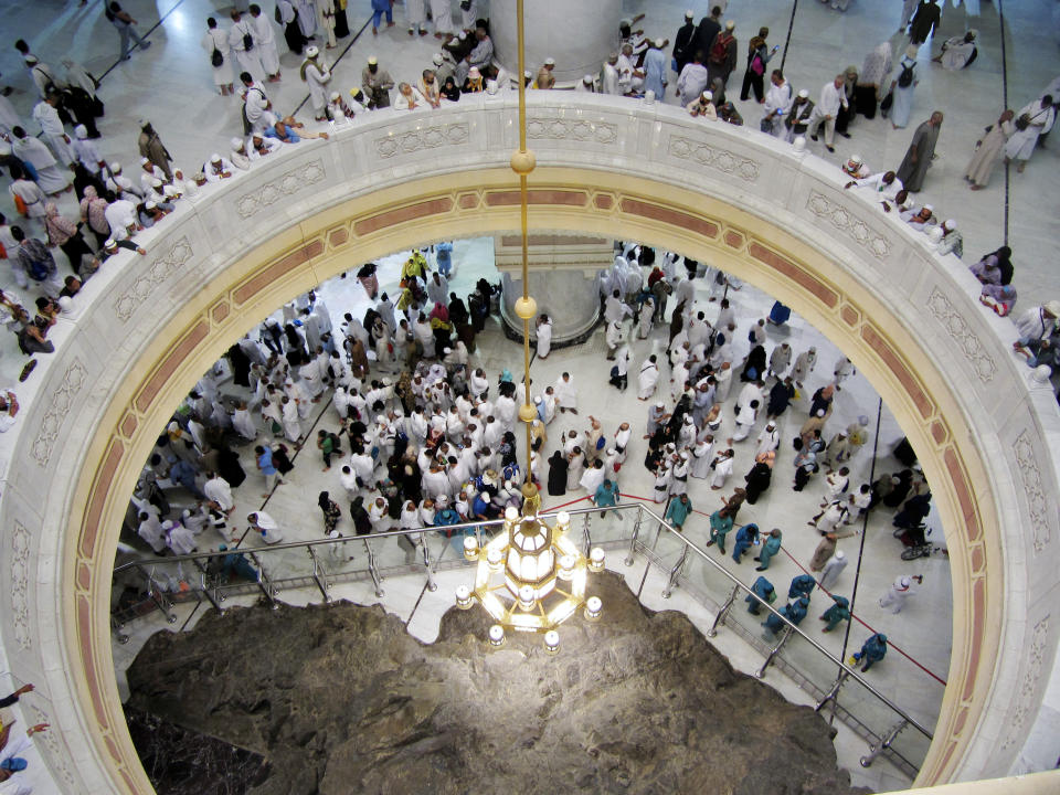 FILE - In this Aug. 9, 2019 file photo pilgrims pray near the Al-Safa mountain, at the Grand Mosque, during the Hajj pilgrimage in the Muslim holy city of Mecca, Saudi Arabia. Saudi Arabia said Tuesday, June 22, 2020 this year’s hajj will not be canceled, but that due to the coronavirus only “very limited numbers” of people will be allowed to perform the pilgrimage that traditionally draws around 2 million people from around the world to Mecca once a year. (AP Photo/Amr Nabil, file)