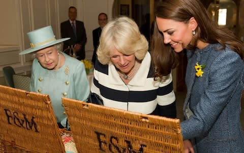 The Queen, Duchess of Cornwall and Duchess of Cambridge at Fortnum and Mason in 2012 - Credit: AFP