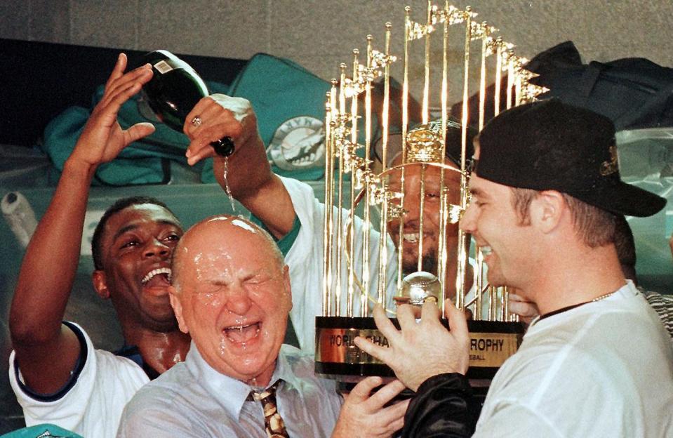 The late H. Wayne Huizenga is believed to be the only person in American history to build three separate Fortune 500 companies. He also was an owner of thr NFL's Miami Dolphins, NHL's Florida Panthers and Major League Baseball's then-Florida Marlins. He's seen here, left, celebrating their first World Series win, in 1997.