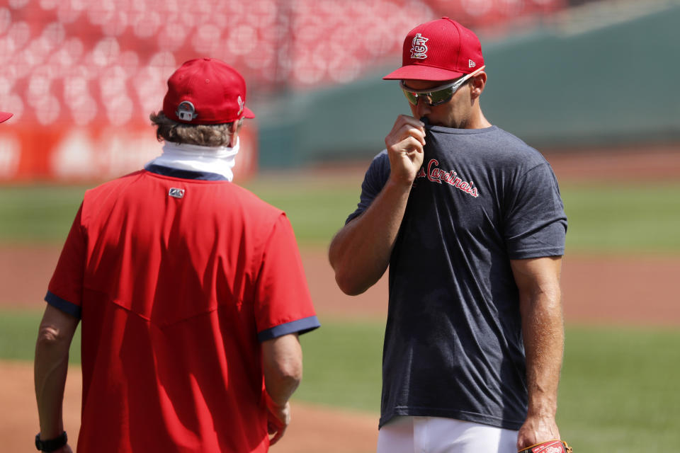 St. Louis Cardinals' Paul Goldschmidt, right, talks with manager Mike Shildt during baseball practice at Busch Stadium Sunday, July 5, 2020, in St. Louis. (AP Photo/Jeff Roberson)