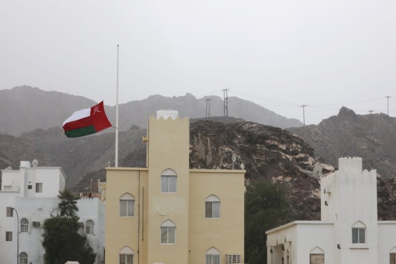 FILE PHOTO: Oman's national flag flies at half mast after the death of Oman's Sultan Qaboos bin Said was announced in Muscat