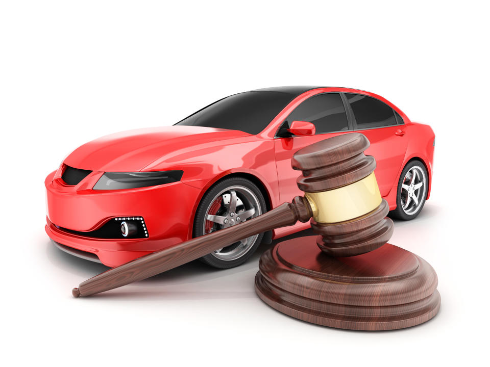 Red car on white background and auction hammer. 3d illustration