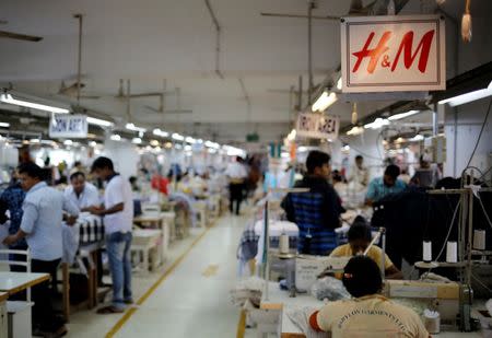 People work at a sweater factory of Wega Group, in Dhaka, Bangladesh July 13, 2016. Picture taken July 13, 2016.REUTERS/Mohammad Hossian Ponir