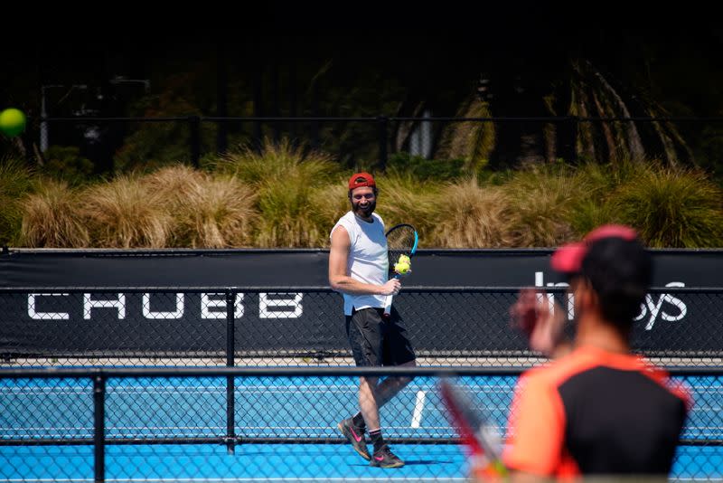 Quarantined Australian Open tennis players train in a restricted area in Melbourne